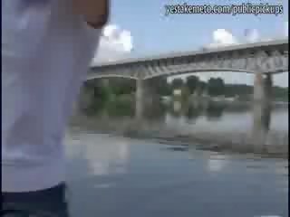 Real amateur brunette has sex in public in a boat and eats the cum