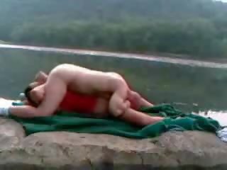 Couple get hot and naughty fucking beside the lake Video